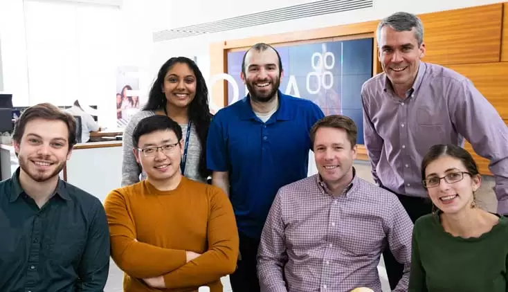 Group of employees smiling on a photo at the Danvers' headquarter.